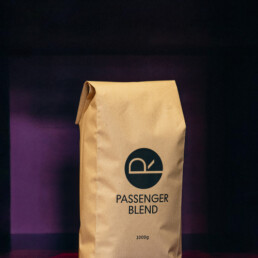 PASSENGER BLEND coffee bag—our house espresso blend featuring flavors of dark chocolate, almond, molasses, and blueberry.